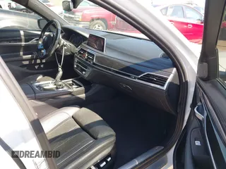 2019 BMW 7 Series 750i with VIN WBA7F0C5XKGM25771, listed as a IAAI auction lot 42167614 with 73,692 mi miles. Bid and sale history available at carsss.com. Image 5.