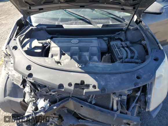 2014 Cadillac SRX z VIN 3GYFNAE37ES609830, wystawiony jako Copart lot #51542955 z przebiegiem 122 560 mil mil oraz Szkoda całkowita • Salvage title. Historia ofert i sprzedaży dostępna na DreamBid. Obrazek 13.