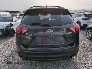 2015 Mazda CX-5 Grand Touring with VIN JM3KE4DY3F0495411, listed as a Copart auction lot 50077765 with 136,191 mi miles and Salvage Title. Bid and sale history available at DreamBid. Image 6.