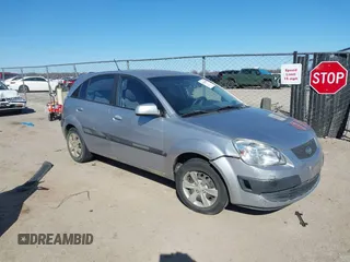 2009 Kia Rio LX with VIN KNADE243596530314, listed as a IAAI auction lot 41681050 with 114,831 mi miles. Bid and sale history available at carsss.com. Image 1.