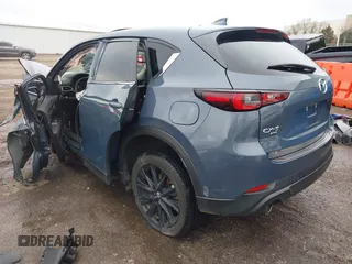 2023 Mazda CX-5 S Carbon Edition z VIN JM3KFBCM9P0109219, wystawiony jako IAAI lot #41183435 z przebiegiem Nie podano mil oraz . Historia ofert i sprzedaży dostępna na DreamBid. Obrazek 3.