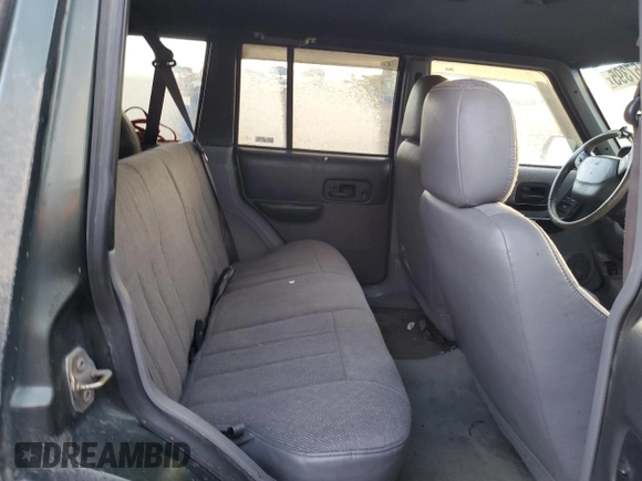 1997 Jeep Cherokee Country with VIN 1J4FJ78SXVL566804, listed as a Copart auction lot 88557395 with 216,230 mi miles and Salvage title. Bid and sale history available at DreamBid. Image 11.