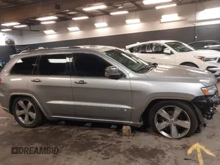 2015 Jeep Grand Cherokee Overland with VIN 1C4RJFCG1FC215426, listed as a IAAI auction lot 41689821 with 128,563 mi miles. Bid and sale history available at carsss.com. Image 14.