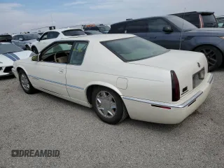 1999 Cadillac Eldorado z VIN 1G6EL12Y7XU615169, wystawiony jako Copart lot #76459744 z przebiegiem Nie podano mil oraz Szkoda całkowita • Salvage title. Historia ofert i sprzedaży dostępna na DreamBid. Obrazek 2.