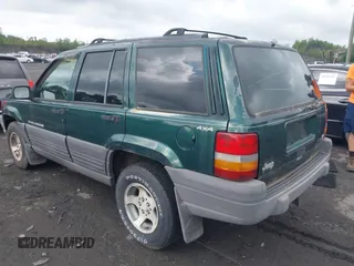 1996 Jeep Grand Cherokee with VIN 1J4EZ58Y7TC128302, listed as a IAAI auction lot 42643449 with 282,036 mi miles and . Bid and sale history available at DreamBid. Image 3.