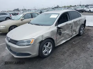 2014 Volkswagen Jetta TDI w/Premium with VIN 3VWLL7AJ3EM231190, listed as a IAAI auction lot 41722137 with 100,965 mi miles and . Bid and sale history available at DreamBid. Image 2.