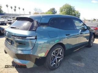 2023 BMW iX M60 with VIN WB533CF01PCM82043, listed as a Copart auction lot 47447815 with 9,058 mi miles and Salvage Title. Bid and sale history available at carsss.com. Image 3.