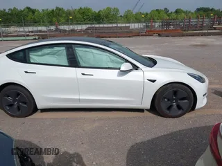 2023 Tesla Model 3 with VIN 5YJ3E1EA4PF644621, listed as a IAAI auction lot 42280312 with 41,262 mi miles and . Bid and sale history available at DreamBid. Image 13.