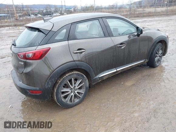 2016 Mazda CX-3 Grand Touring with VIN JM1DKBD77G0107328, listed as a IAAI auction lot 41682949 with 156,935 mi miles. Bid and sale history available at carsss.com. Image 4.