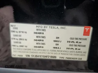 2017 Tesla Model S 60 z VIN 5YJSA1E15HF218686, wystawiony jako Copart lot #44689465 z przebiegiem 101 964 mil mil oraz Szkoda całkowita • Salvage title. Historia ofert i sprzedaży dostępna na DreamBid. Obrazek 14.