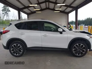 2016 Mazda CX-5 Grand Touring with VIN JM3KE2DYXG0675619, listed as a IAAI auction lot 42137144 with 106,262 mi miles and . Bid and sale history available at DreamBid. Image 13.