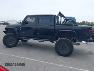 2020 Jeep Gladiator Rubicon z VIN 1C6JJTBG7LL102189, wystawiony jako IAAI lot #42320968 z przebiegiem 68 266 mil mil oraz . Historia ofert i sprzedaży dostępna na DreamBid. Obrazek 14.