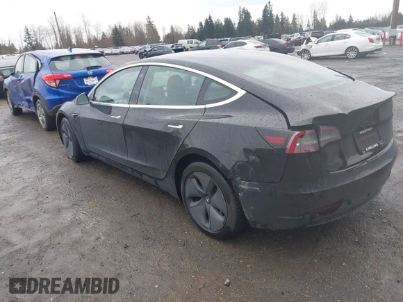 2019 Tesla Model 3 Mid Range with VIN 5YJ3E1EAXKF296378, listed as a IAAI auction lot 41739616 with 77,100 mi miles and . Bid and sale history available at DreamBid. Image 3.