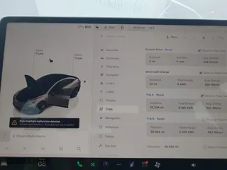 2023 Tesla Model 3 with VIN 5YJ3E1EA7PF642913, listed as a IAAI auction lot 41898249 with 26,394 mi miles. Bid and sale history available at carsss.com. Image 7.