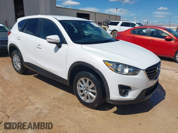 2016 Mazda CX-5 Touring z VIN JM3KE2CY0G0840918, wystawiony jako IAAI lot #42205529 z przebiegiem 74 515 mil mil oraz . Historia ofert i sprzedaży dostępna na DreamBid. Obrazek 1.