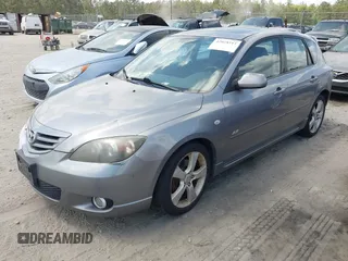 2005 Mazda 3 s with VIN JM1BK343151259901, listed as a IAAI auction lot 42028513 with 209,689 mi miles. Bid and sale history available at carsss.com. Image 2.