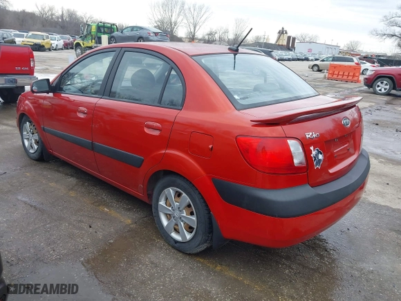 2009 Kia Rio SX with VIN KNADE223796561406, listed as a IAAI auction lot 41650749 with 100,041 mi miles. Bid and sale history available at carsss.com. Image 3.