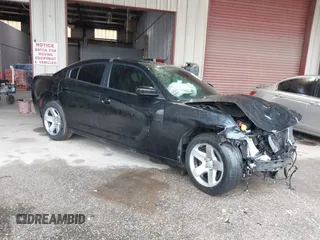 2021 Dodge Charger Police with VIN 2C3CDXAT5MH663136, listed as a IAAI auction lot 40348927 with 66,501 mi miles and . Bid and sale history available at DreamBid. Image 1.