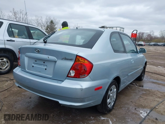 2003 Hyundai Accent GL with VIN KMHCG35C23U264360, listed as a IAAI auction lot 42033316 with 100,991 mi miles. Bid and sale history available at carsss.com. Image 4.