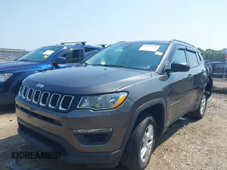 2018 Jeep Compass Sport with VIN 3C4NJDAB7JT235218, listed as a IAAI auction lot 42473771 with 106,302 mi miles and . Bid and sale history available at DreamBid. Image 2.