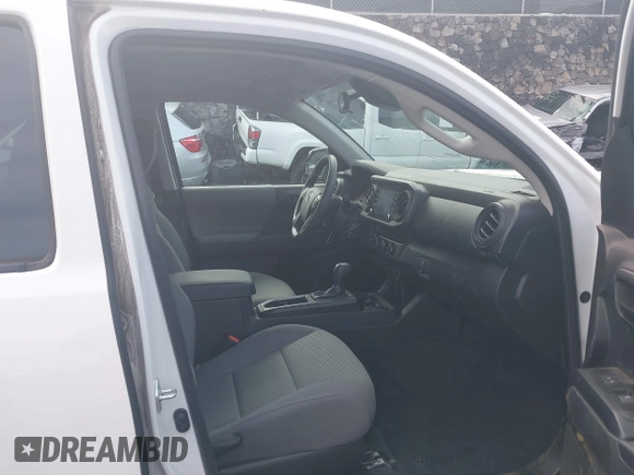 2023 Toyota Tacoma SR with VIN 3TYCZ5AN4PT168312, listed as a IAAI auction lot 42555775 with 8,288 mi miles and . Bid and sale history available at DreamBid. Image 5.