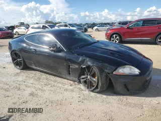 2010 Jaguar XK with VIN SAJWA4DC1AMB38762, listed as a Copart auction lot 73865884 with 98,030 mi miles and Salvage Title. Bid and sale history available at carsss.com. Image 4.