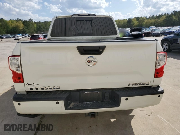 2019 Nissan Titan Pro-4X z VIN 1N6AA1E51KN526104, wystawiony jako Copart lot #51694335 z przebiegiem 56 620 mil mil oraz Szkoda całkowita • Salvage title. Historia ofert i sprzedaży dostępna na DreamBid. Obrazek 6.