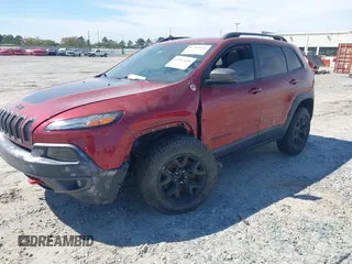 2015 Jeep Cherokee Trailhawk with VIN 1C4PJMBS1FW640483, listed as a IAAI auction lot 41883688 with 103,589 mi miles. Bid and sale history available at carsss.com. Image 17.