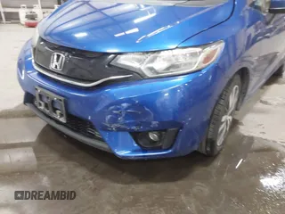 2016 Honda Fit EX z VIN JHMGK5H76GX041661, wystawiony jako IAAI lot #42162223 z przebiegiem 36 066 mil mil oraz . Historia ofert i sprzedaży dostępna na DreamBid. Obrazek 6.