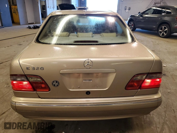 2002 Mercedes-Benz E-Class with VIN WDBJF65J12B485293, listed as a Copart auction lot 77561984 with 140,708 mi miles and Salvage Title. Bid and sale history available at carsss.com. Image 6.