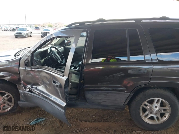 2004 Jeep Grand Cherokee Laredo with VIN 1J4GX48N64C436853, listed as a IAAI auction lot 41785918 with 118,578 mi miles. Bid and sale history available at carsss.com. Image 13.