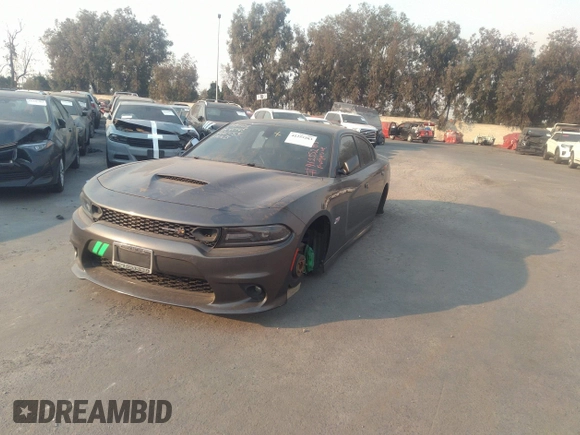 2019 Dodge Charger Scat Pack with VIN 2C3CDXGJ2KH564051, listed as a IAAI auction lot 41255283 with 64,687 mi miles and . Bid and sale history available at DreamBid. Image 2.