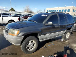 1999 Jeep Grand Cherokee Laredo with VIN 1J4GW58N9XC633464, listed as a Copart auction lot 84682454 with 212,738 mi miles and Salvage Title. Bid and sale history available at carsss.com. Image 1.