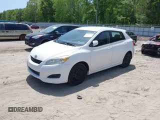2009 Toyota Matrix with VIN 2T1KU40E39C091087, listed as a IAAI auction lot 42033558 with 338,496 mi miles. Bid and sale history available at carsss.com. Image 2.