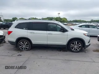 2016 Honda Pilot Elite with VIN 5FNYF6H00GB104329, listed as a IAAI auction lot 41905390 with 125,501 mi miles. Bid and sale history available at carsss.com. Image 13.