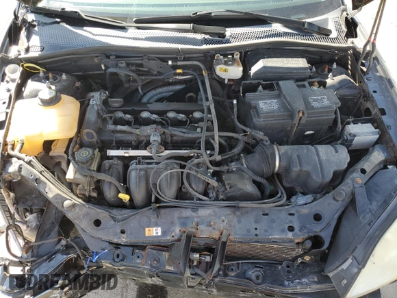 2007 Ford Focus S z VIN 1FAHP37N07W161088, wystawiony jako Copart lot #54140415 z przebiegiem 241 367 mil mil oraz Szkoda całkowita • Salvage title. Historia ofert i sprzedaży dostępna na DreamBid. Obrazek 11.