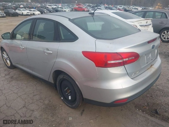 2015 Ford Focus SE with VIN 1FADP3F23FL276810, listed as a IAAI auction lot 41799093 with 127,048 mi miles. Bid and sale history available at carsss.com. Image 3.