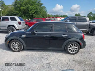 2016 MINI Hardtop 4 Door S z VIN WMWXU3C53G2D30807, wystawiony jako IAAI lot #42545577 z przebiegiem 86 952 mil mil oraz . Historia ofert i sprzedaży dostępna na DreamBid. Obrazek 14.
