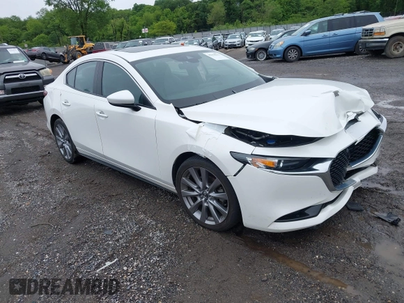 2021 Mazda 3 Preferred z VIN 3MZBPBCL0MM250862, wystawiony jako IAAI lot #42318612 z przebiegiem 86 056 mil mil oraz . Historia ofert i sprzedaży dostępna na DreamBid. Obrazek 1.