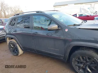 2017 Jeep Cherokee Trailhawk with VIN 1C4PJMBS4HW647852, listed as a IAAI auction lot 41192324 with 116,429 mi miles and . Bid and sale history available at DreamBid. Image 13.