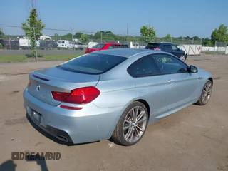 2013 BMW 6 Series 650i z VIN WBAYM9C57DDW20410, wystawiony jako IAAI lot #42348010 z przebiegiem 146 985 mil mil oraz . Historia ofert i sprzedaży dostępna na DreamBid. Obrazek 4.
