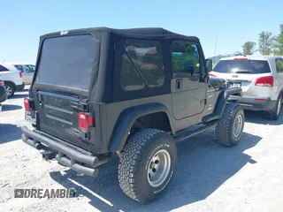 2002 Jeep Wrangler Sport with VIN 1J4FA49S52P700846, listed as a IAAI auction lot 42052276 with 231,851 mi miles. Bid and sale history available at carsss.com. Image 4.