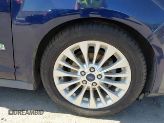 2017 Ford C-Max SE z VIN 1FADP5AU0HL115421, wystawiony jako IAAI lot #42216348 z przebiegiem 145 415 mil mil oraz . Historia ofert i sprzedaży dostępna na DreamBid. Obrazek 18.