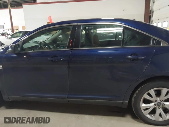 2011 Ford Taurus SEL with VIN 1FAHP2EW7BG174493, listed as a IAAI auction lot 41697856 with 143,957 mi miles. Bid and sale history available at carsss.com. Image 14.