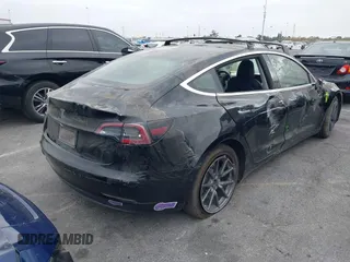 2019 Tesla Model 3 Mid Range with VIN 5YJ3E1EA2KF362048, listed as a IAAI auction lot 40141734 with 70,321 mi miles and . Bid and sale history available at carsss.com. Image 4.