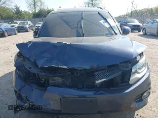 2014 Volkswagen Tiguan S z VIN WVGBV3AX7EW545538, wystawiony jako IAAI lot #42083281 z przebiegiem 129 227 mil mil oraz . Historia ofert i sprzedaży dostępna na DreamBid. Obrazek 12.