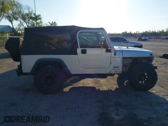 2005 Jeep Wrangler Unlimited with VIN 1J4FA44S65P335444, listed as a IAAI auction lot 41731093 with 143,918 mi miles. Bid and sale history available at carsss.com. Image 13.