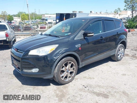 2013 Ford Escape SEL with VIN 1FMCU9H97DUA51529, listed as a IAAI auction lot 42164245 with 106,649 mi miles and . Bid and sale history available at DreamBid. Image 2.