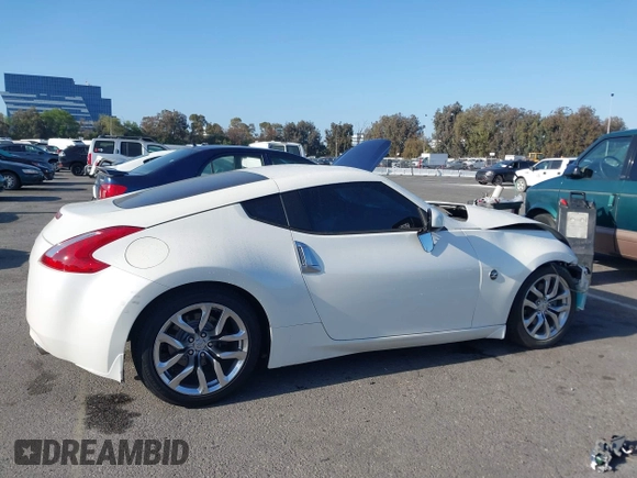 2014 Nissan 370Z Touring with VIN JN1AZ4EH7EM635655, listed as a IAAI auction lot 42217280 with 150,200 mi miles and . Bid and sale history available at DreamBid. Image 13.