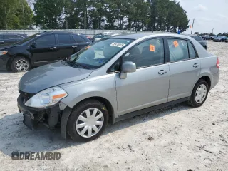 2010 Nissan Versa S with VIN 3N1BC1AP3AL433076, listed as a Copart auction lot 59470005 with 111,582 mi miles and Salvage title. Bid and sale history available at DreamBid. Image 1.